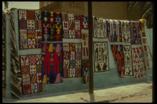 Carpets for sale on a wall in Tunisia